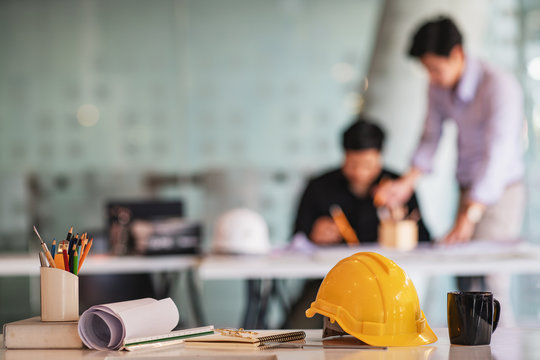 Business engineer contractor who contracts to supplies consulting about working their job at construction site office headquarters.