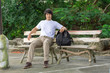 © PRASERT - male tourist in the park. Tourism and travel concept, cargo pants