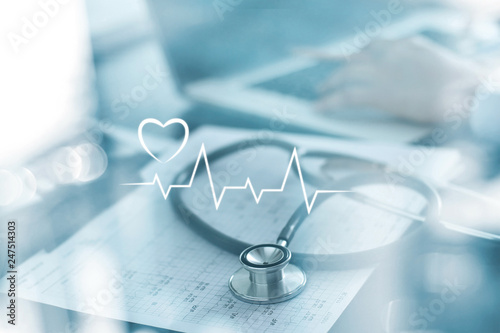 Cuadros en Lienzo Stethoscope with heart beat report and doctor analyzing checkup on laptop in health medical laboratory background