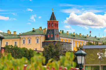 View of tower and buildings of Moscow Kremlin on a background of green trees from Aleksandrovskiy garden