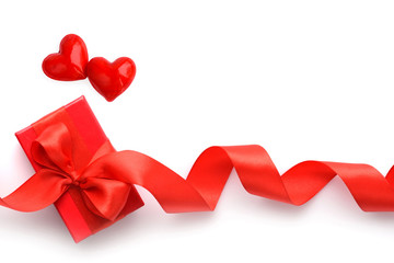 Wall Mural - Valentines Day background. Two hearts and red gift box on white background