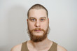 © vika33 - close-up portrait serious calm bearded not trimmed guy in the background