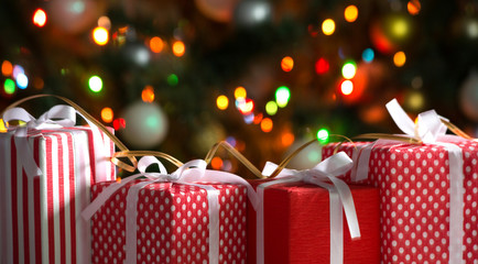 Christmas gifts on festive lights background