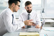 © chagin - Businessmen working in an office