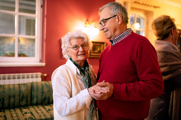 Wall Mural - Older couple dancing in the room