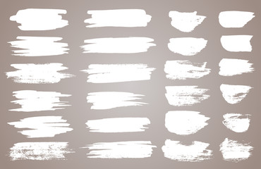 Set of white ink vector stains. Vector black paint, ink brush stroke, brush, line or round texture. Dirty artistic design element, box, frame or background for text.