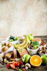 Wall Mural - Healthy food. Selection of good carbohydrate sources, high fiber rich food. Low glycemic index diet. Fresh vegetables, fruits, cereals, legumes, nuts, greens.  copy space