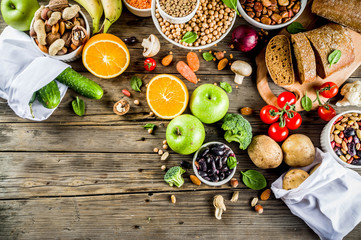 Wall Mural - Healthy food. Selection of good carbohydrate sources, high fiber rich food. Low glycemic index diet. Fresh vegetables, fruits, cereals, legumes, nuts, greens.  copy space