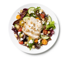 Grilled Chicken On A Bed Of Salad Greens On A White Background