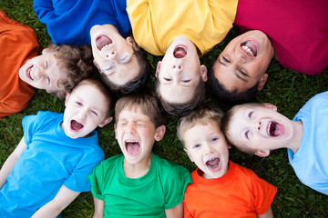 Group of Boys Yelling in Grass Outside