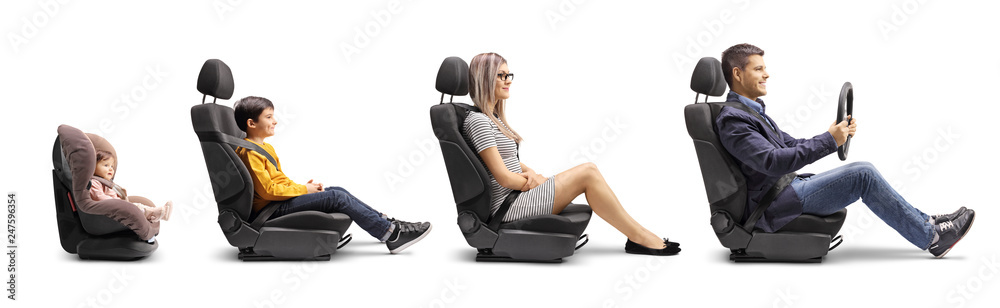 Father, mother, boy and baby in car seats with a fastened seat belt simulating a car ride - obrazy, fototapety, plakaty 