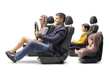 Wall Mural - Family of four in car seats with a fastened seat belts