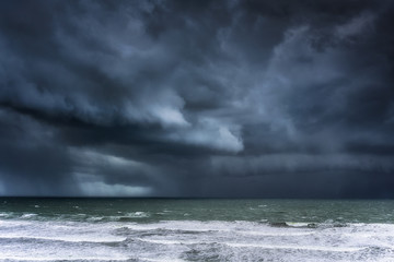Wall Mural -  stormy clouds and rain on the sea