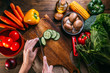© ADDICTIVE STOCK - Vegetables and utensils on kitchen table