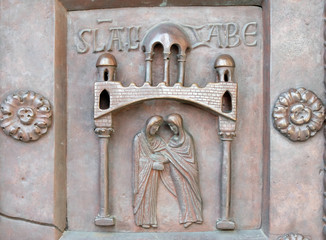 Wall Mural - Visitation of the Virgin Mary on the San Ranieri gate of the Cathedral St. Mary of the Assumption in Pisa, Italy 