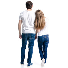 Woman and man goes relationships looking on a white background. Isolation, back view