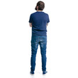 © Kabardins photo - A man in jeans looks on a white background. Isolation, back view