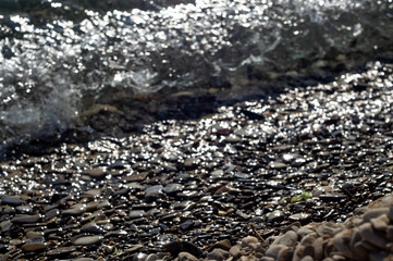 Stones on beach and sea water