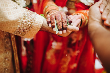 Ritual with coconut leaves during traditional Hindu wedding ceremony