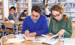 © JackF - Young people preparing for exam in library