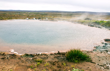 Haukadalur Valley is a famous landmark of Iceland. Here are geysers, round ponds with hot and turquoise water. A unique phenomenon.