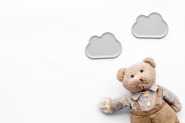 baby care. newborn baby concept. baby sleep concept. teddy bear toy near clouds on white background 