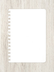 White paper sheet on wood texture for business background.