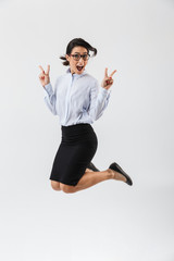 Canvas Print - Full length portrait of a pretty businesswoman jumping