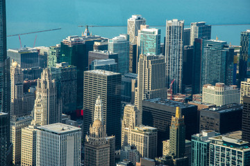  Chicago downtown aerial view at dusk with skyscrapers and city skyline at Michigan lakefront.