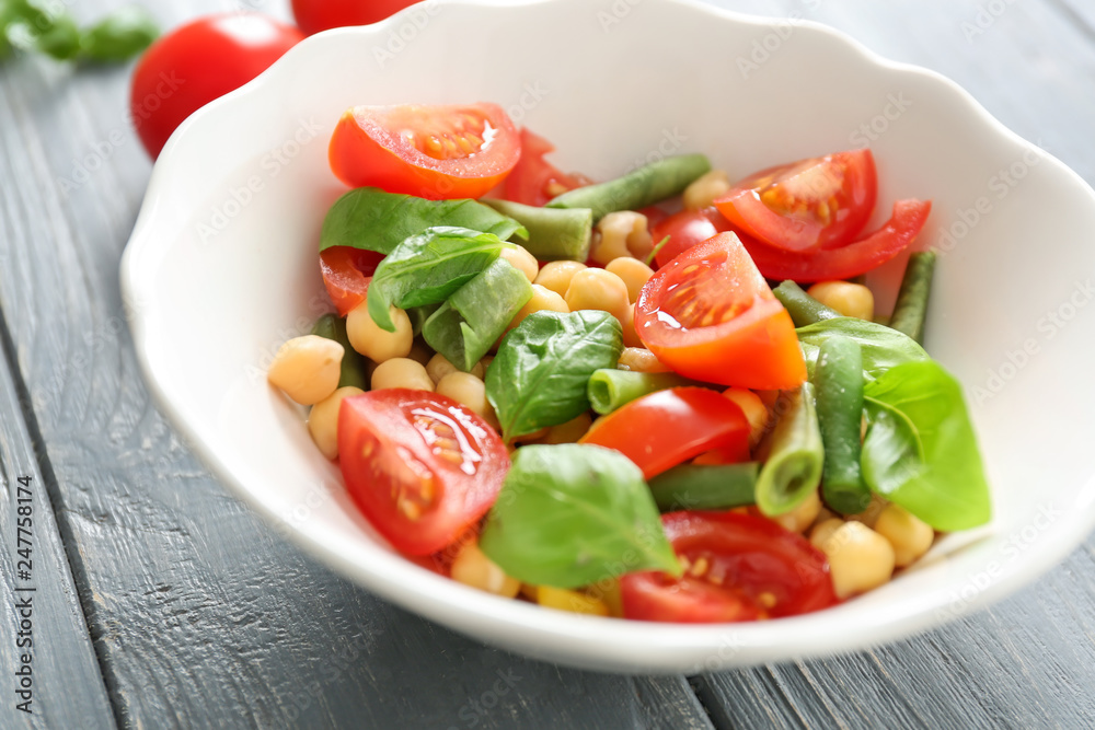 Plate with fresh vegetable salad on table. Diet food