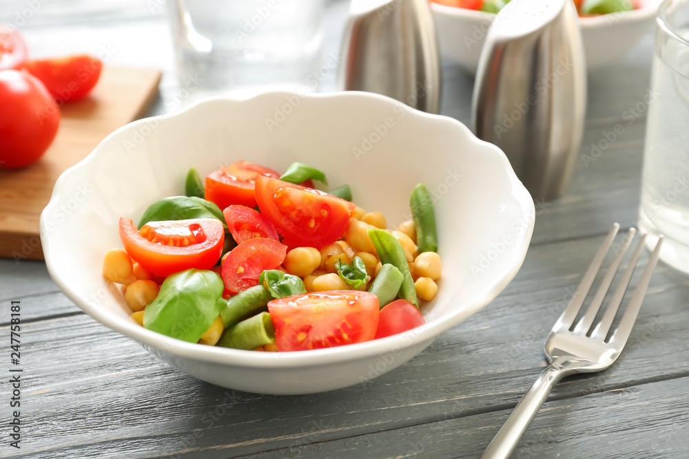 Plate with fresh vegetable salad on table. Diet food
