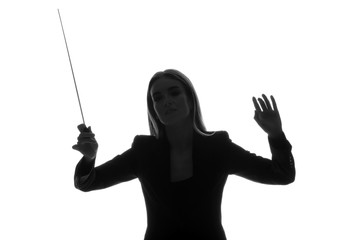 Wall Mural - Silhouette of female orchestral conductor on white background