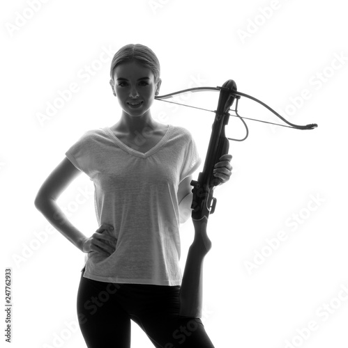 Photographie Portrait of beautiful woman with crossbow on white background