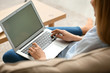 © Pixel-Shot - Beautiful young woman using laptop at home