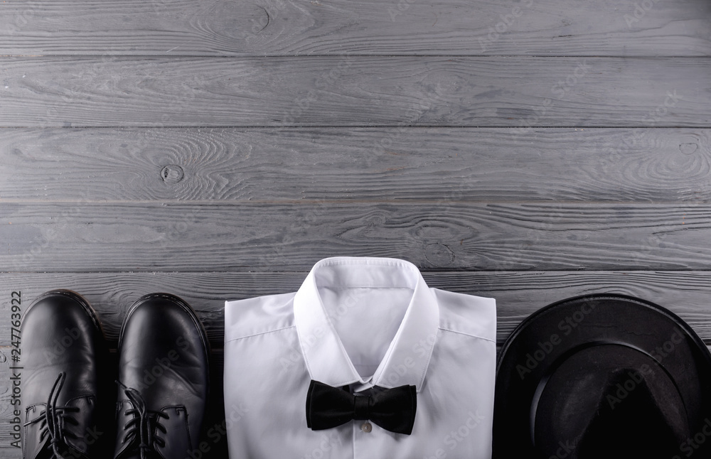 Stylish men's clothes on wooden background