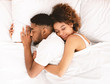 © Prostock-studio - Loving couple sleeping in bed and hugging