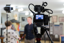 Video Of The Interview. Television Equipment, Camcorder With LCD Screen, Lighting Equipment.