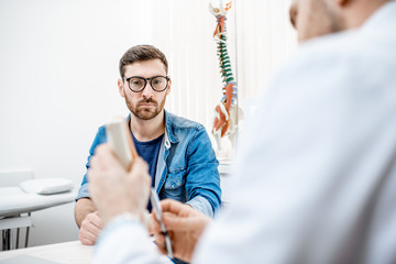 Man with sad emotions during the medical consultation at the therapist office