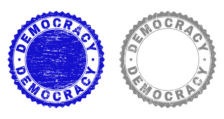 Grunge DEMOCRACY stamp seals isolated on a white background. Rosette seals with grunge texture in blue and gray colors. Vector rubber stamp imprint of DEMOCRACY text inside round rosette.