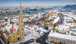 Budapest, Hungary - Aerial panoramic view of the snowy Buda district with Matthias Church, Buda Castle Royal Palace, Szechenyi Chain Bridge and Statue of Liberty at winter time