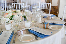 Wedding Table Decoration Series - Tables Set For Beautiful Indoor Catered Luxury Wedding Event With Blue Napkins 