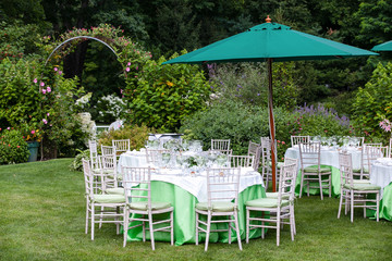 Wall Mural - Outdoor tables set for fine dining during a wedding.