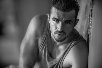 Portrait of a handsome caucasian male model posing on the beach