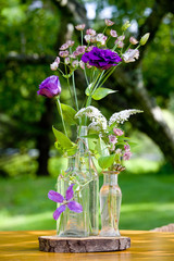 Wall Mural - Wedding flower arrangement series. Bouquet of flowers for a wedding event in clear bottles