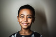 © Kristen Blush - Portrait of smiling boy standing indoors