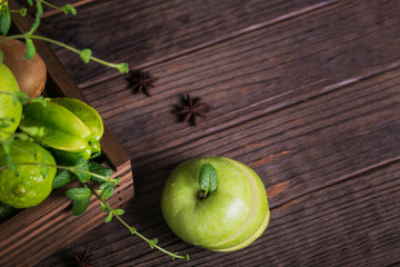 Wall Mural - Set of green fruits for healthy diet and detox: apple, lime, kiwi, mango, carambola and mint.