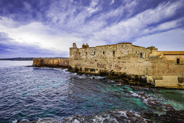 Wall Mural - View of the castello maniace in Syracuse with dramatic sky, Sicily