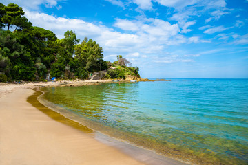 Wall Mural - Beach holiday on the coast of Cefalu in summertime, blue sea water in a sunny day in Italy