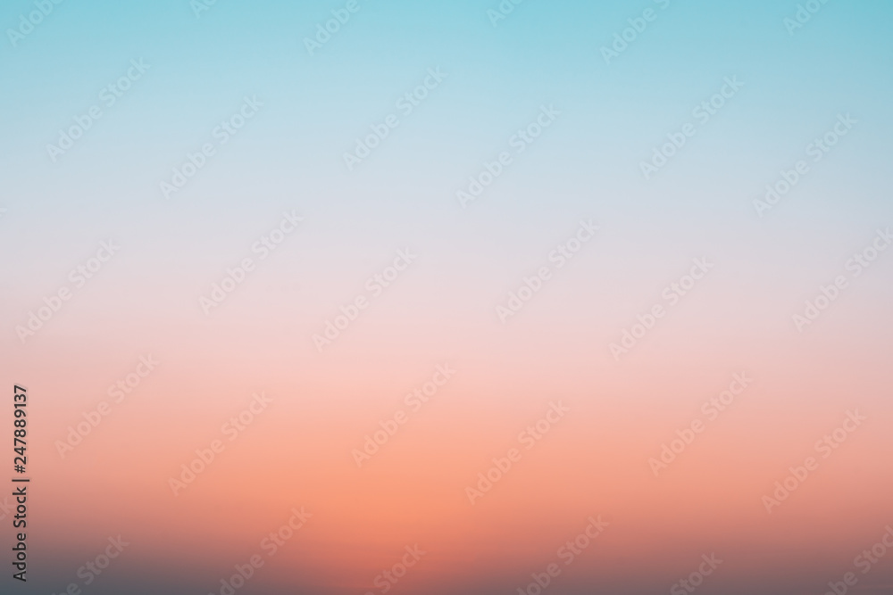 Abstract gradient sunrise in the sky with blue and orange natural background. - obrazy, fototapety, plakaty 