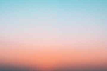 Abstract gradient sunrise in the sky with blue and orange natural background.